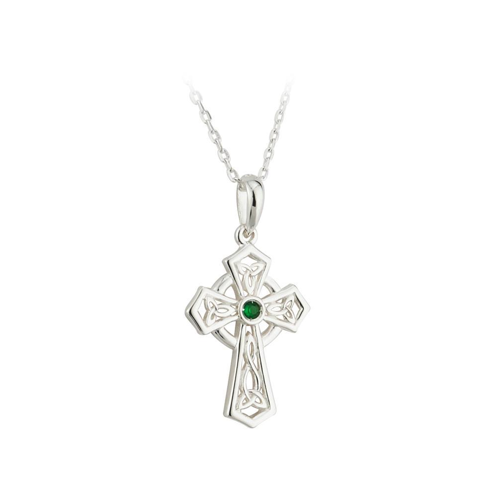 A sterling silver Celtic Cross pendant featuring a Trinity Knot design and a green gem at the center, attached to a silver rolo chain necklace.